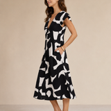 Camelia | Vestido midi fluido con un estampado brillante